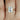 Close-up of 14kt Rose Gold Dainty Emerald Engagement Ring