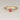 088ct Ready to Ship Petite Elise 14kt Gold Coral Sorbet Peach Sapphire Diamond Minimalist 3 Stone Round Engagement Ring displayed on a white background