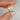 Hand model wearing the 270cts Esther 9mm & Remy 14kt Gold Moissanite Diamond Cluster 4 Prong Round Solitaire Bridal Set to showcase its size and fit