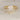 Close-up of Rayna 20 14kt Gold White Sapphire Graduated Nesting Ring on white background